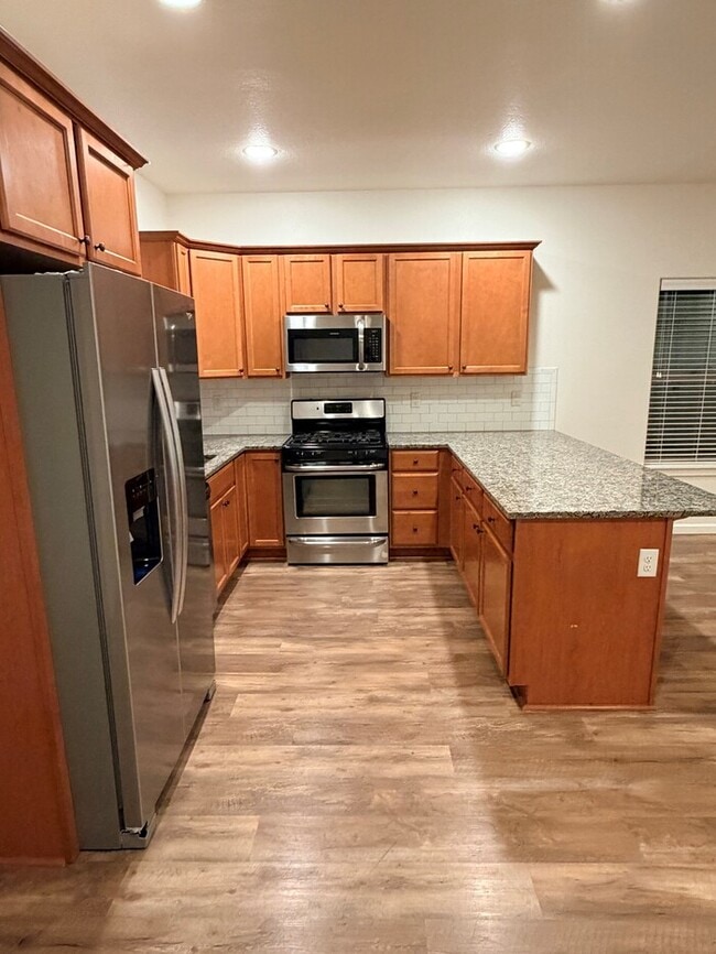 Photo - Beautiful Home w/Gas Fireplace, Plank Flooring, Fenced Yard, Garage, W/D & MORE!