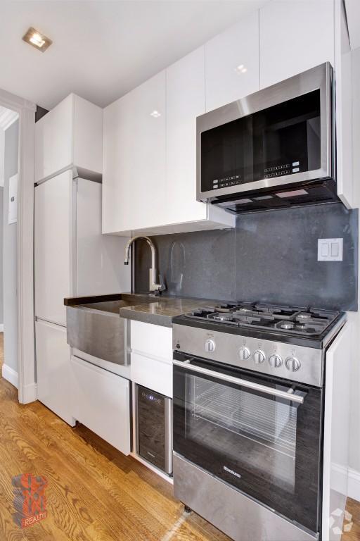 Building Photo - 410 E 13th St Unit 6C Rental