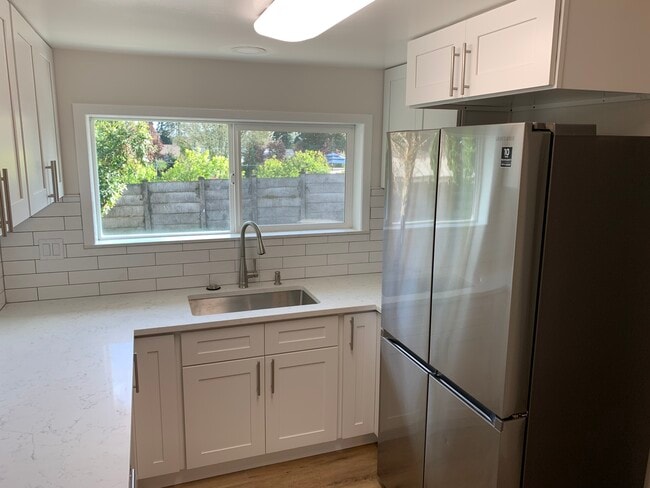 New Kitchen with Tile, Stone Countertops and Stainless Steel Appliances - 4018 NE 54th Ave
