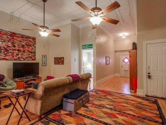 Living room with high ceilings. - 1137 W 41st St Apartment Unit 1W