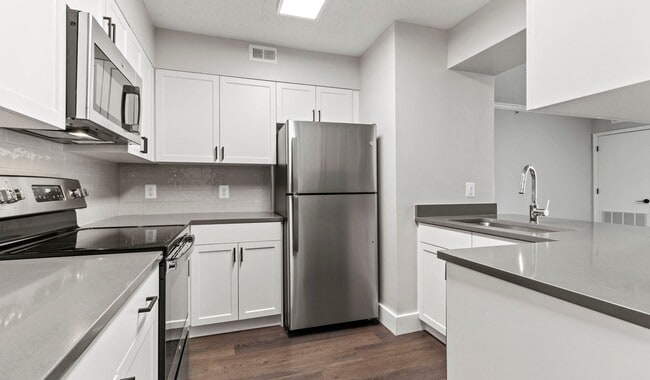 Select homes have upgraded kitchens with quartz countertops and wood flooring