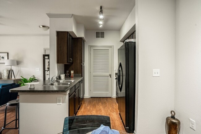 Chef-inspired kitchens with kitchen islands in select residences