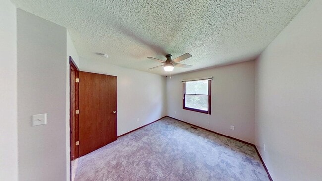 Photo - Clean three bedroom one bath duplex with walk out basement with yard looking at trees, across fro...