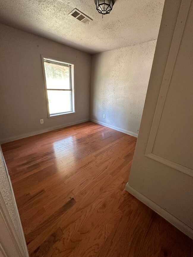 Photo - 2 BEDROOM 1 BATH HOUSE ALL ELECTRIC CENTRAL HEAT & AIR HAS STACK WASHER/DRYER CONNECTION.