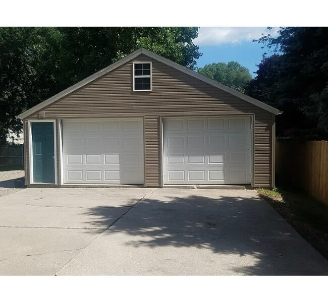 two and a half car garage with garage door opener on left side garage door - 626 George St