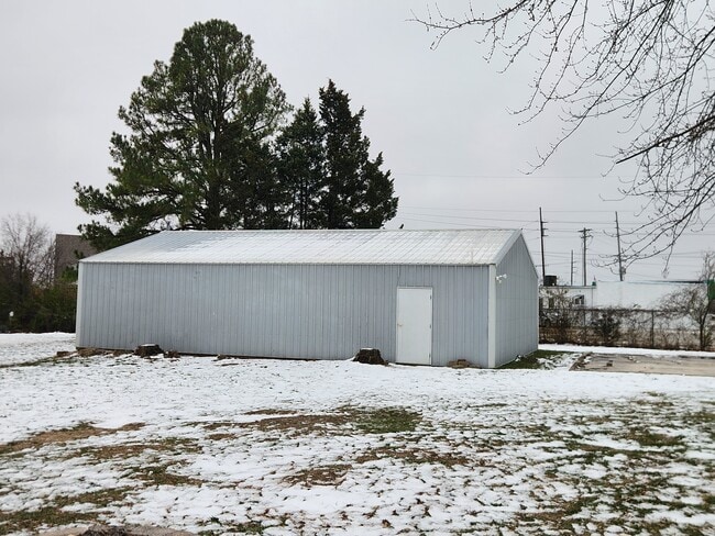 Pole barn garage space for parking and personal storage only. - 13131 East Ln
