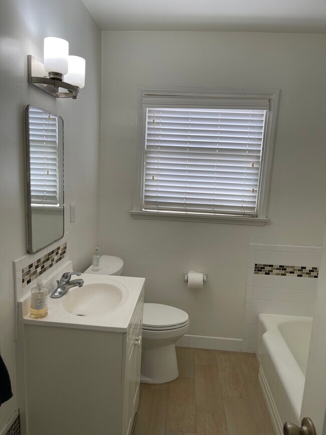 Bathroom with separate tub - 10785 Wilkins Ave Apartment Unit 10785 Wilkins