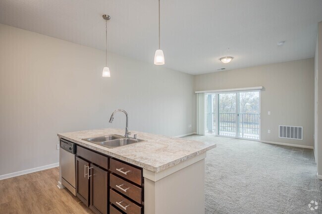 1BR,1.5BA - 849SF - Kitchen and Living Room