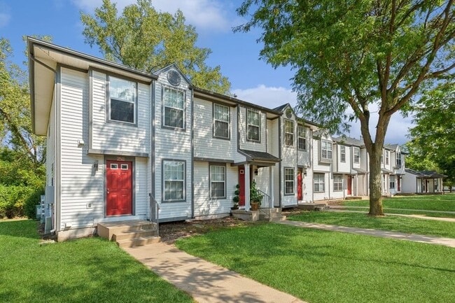 A row of town houses with a red door - Mason Street Townhomes