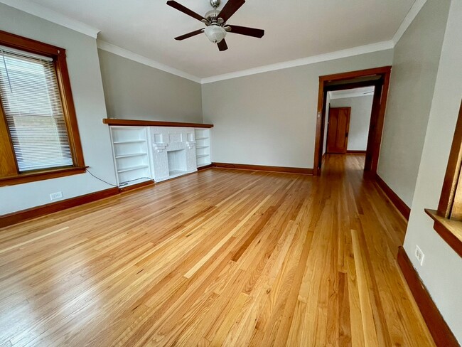 Living room connects to dining room - 5336 W Dakin St Unit 1st Floor