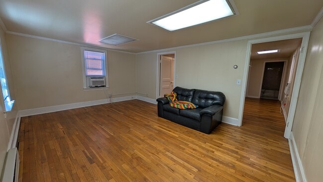 Reverse angle on the living room. - 20 W Main St Unit 200