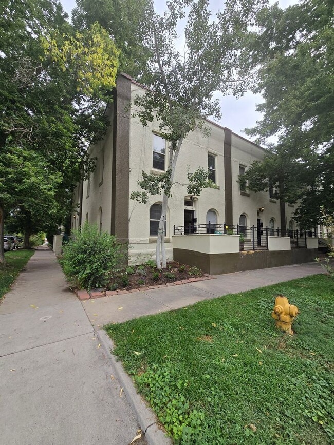 Building Photo - This updated and welcoming condo in the he...