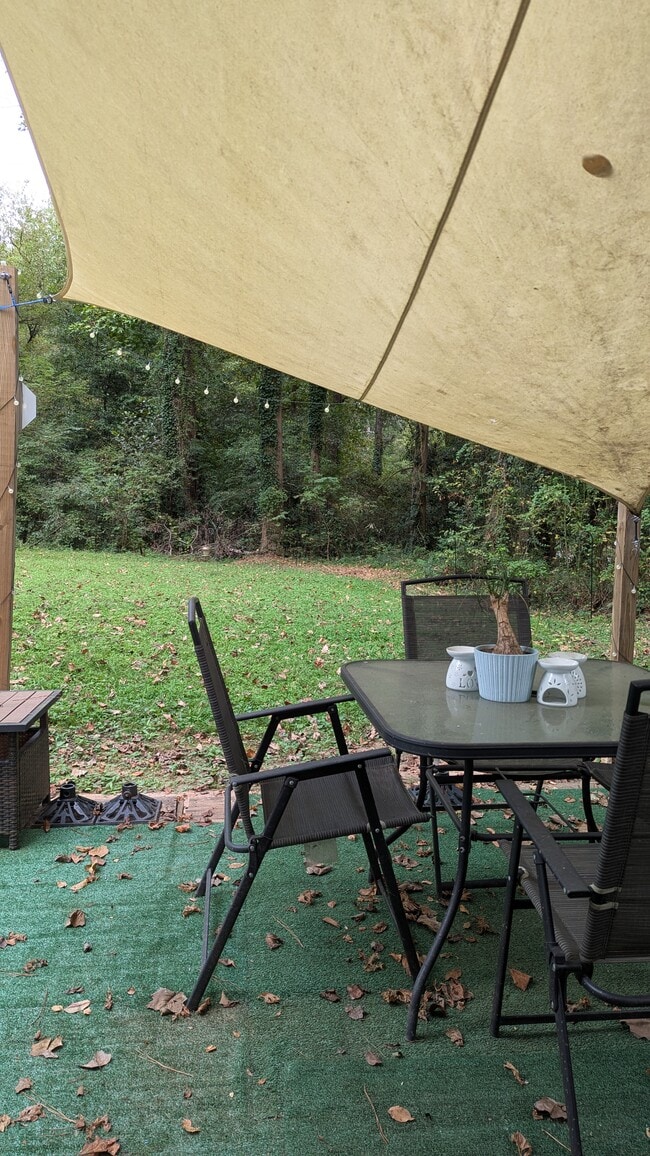 Seating on patio just outside studio apartment. - 3182 Latona Dr SW