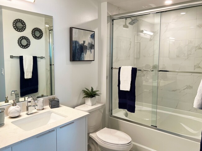 Frameless Glass Shower Enclosures and Deep Soaking Tubs - Sea View at Dania Apartments