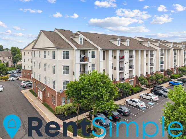 Building Photo - 21210 McFadden Square Unit 402