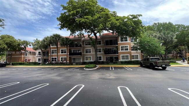 Building Photo - 8851 Wiles Rd Unit 108