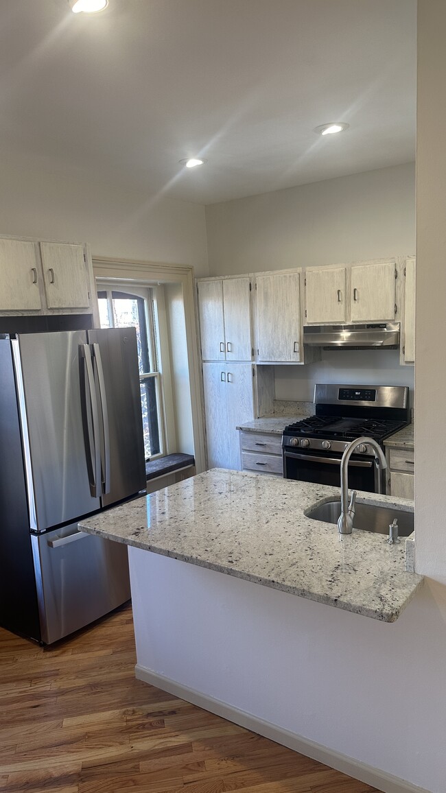 Kitchen with granite countertops - 143 Sussex St Unit Apt. #4