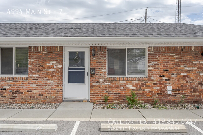 Building Photo - 4994 Main St Unit 7