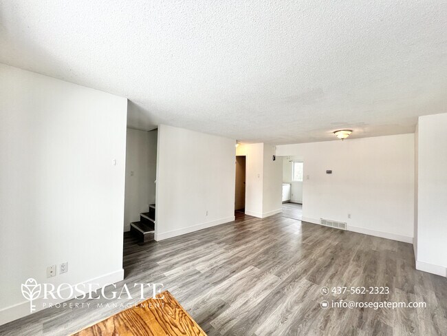 Photo - Spacious 4-Bedroom Townhouse with Front Porch & Parking in London Unit 32