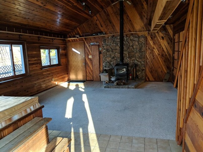 Awesome 2 season room (not well insulated) with wood burning fire place, old hot tub, and loft. Train set goes around entire room. - 28 James Circle House