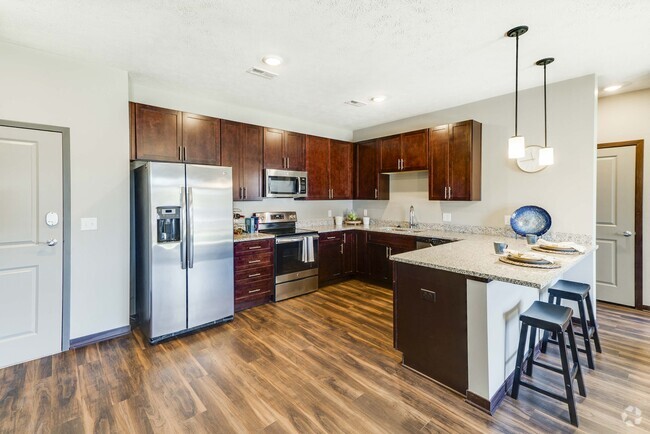 Our kitchens combine functionality and style with plenty of storage and modern appliances to enhance your culinary experience. - 360 at Jordan West Rental