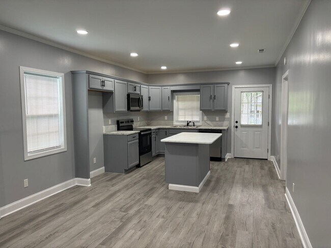 Photo - Fully renovated 3 bedroom 2 bathroom house! Lawn Care Included