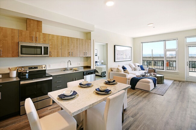Experience coastal living in style with this open-concept space featuring ocean views and modern finishes.