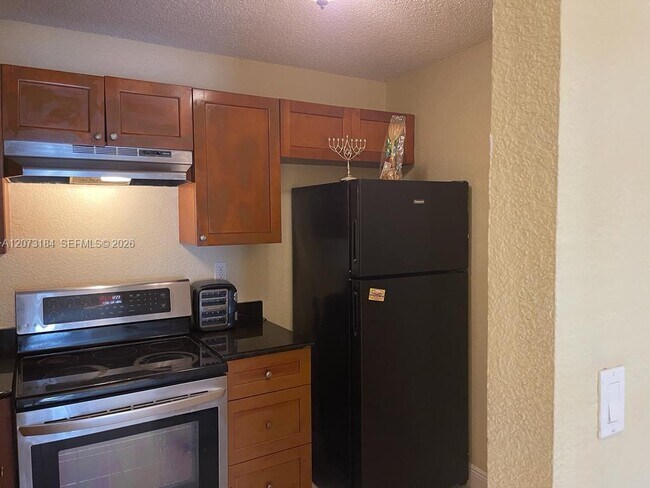 Building Photo - 4251 NW 5th St Unit 112