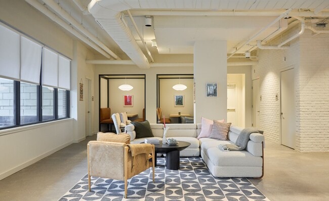 Community co-working area with private meeting rooms and offices
