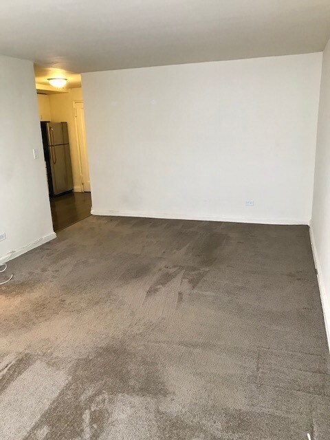 Back of main room showing kitchen - 105-25 67th Ave Unidad 4C