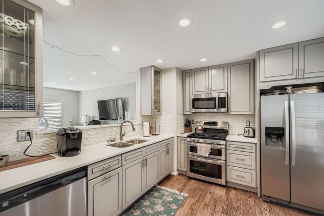 Photo - LOCATION, LOCATION! Featuring modern finishes and a peaceful outdoor retreat, this 2-bed 2.5-bath...