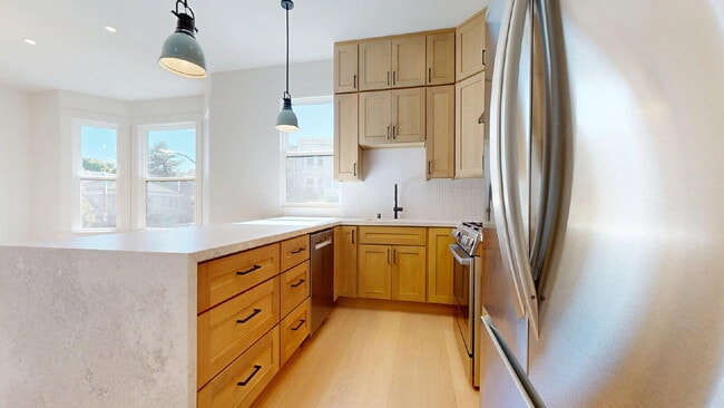 Photo - Modern, Convenient, Bright, Renovated 3BR/1BA Top Floor Flat with Dishwasher & In Unit Laundry