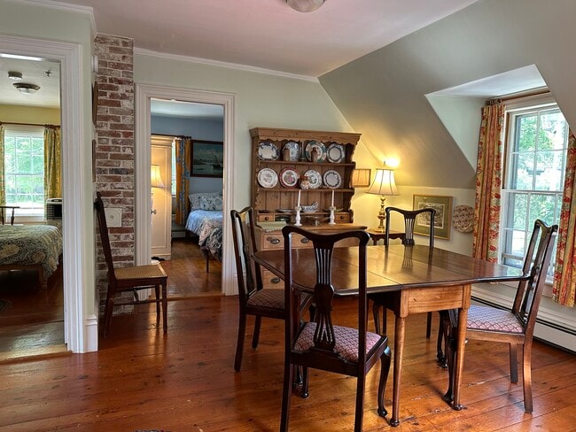 The dining room leads on from the kitchen. Door to Blue Bedroom by the dresser. - 4 Bayview Sq Unit Upstairs Apartment