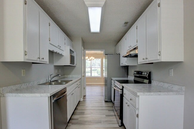 Photo - Stunning Brick Front Home With Fireplace And Hardwood Flooring In Sango Area