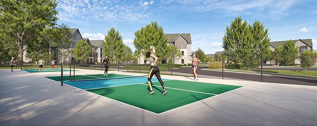 Experience active living with our vibrant pickleball courts set amidst serene scenery and elegant homes. - Farmhouse at Lantern Commons