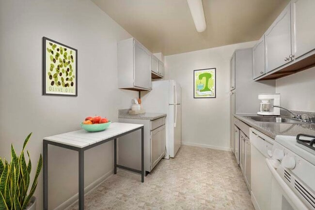 Fully-equipped kitchen at Iverson Towers & Anton House apartments in Temple Hills, MD
