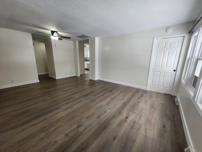 Living room from the front entry (bathroom to the left, kitchen in the middle, bedroom to right) - 905 Woodmere Dr Apartment