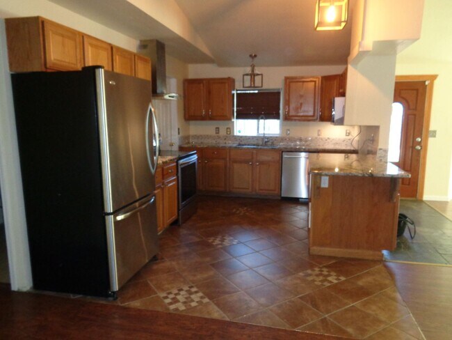 Photo - Spacious 5-Bedroom Home with Fenced Backya...