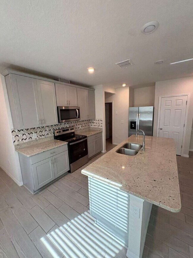 Photo - Stylish 2BR Corner Unit in Ocoee with Attached Garage, Quartz Kitchen & Prime Location Unit Greens at Forest Lake