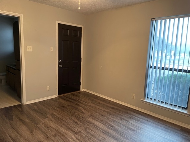 one bedroom with wood flooring (bedroom)