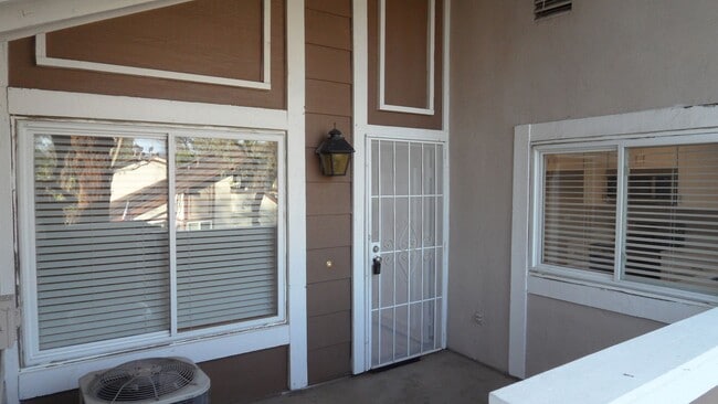 Building Photo - REMODELED 2BR; 2BA end unit condo with 1 car garage & 1 parking space