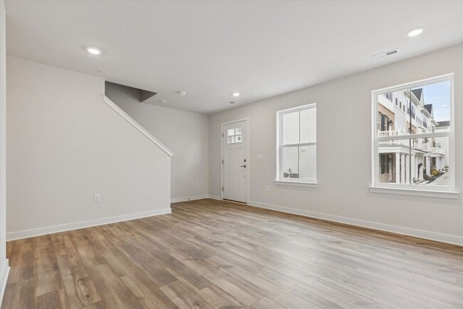 Photo - COMING SOON! Brand New River Pointe townhome with modern finishes, flexible living space, and a p...