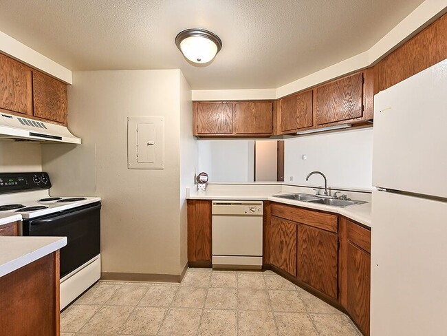 Kitchen with Oven and Dishwasher - Rivers Edge Apartments