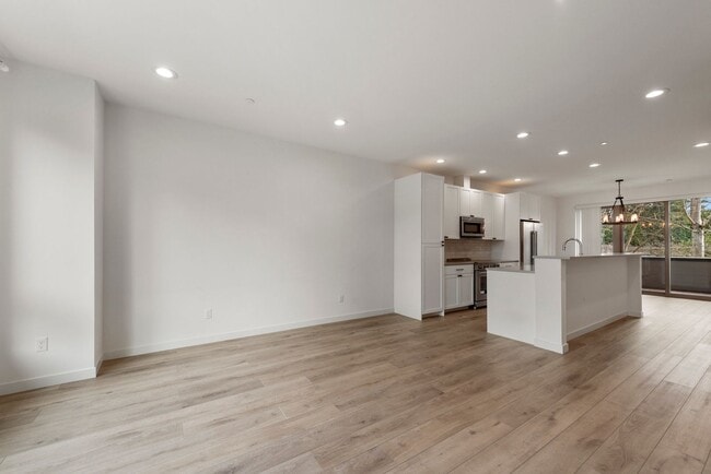 Photo - Modern 3 Bed 3.5 Bath Townhome with Garage, Balcony and Fenced Yard Near Light Rail