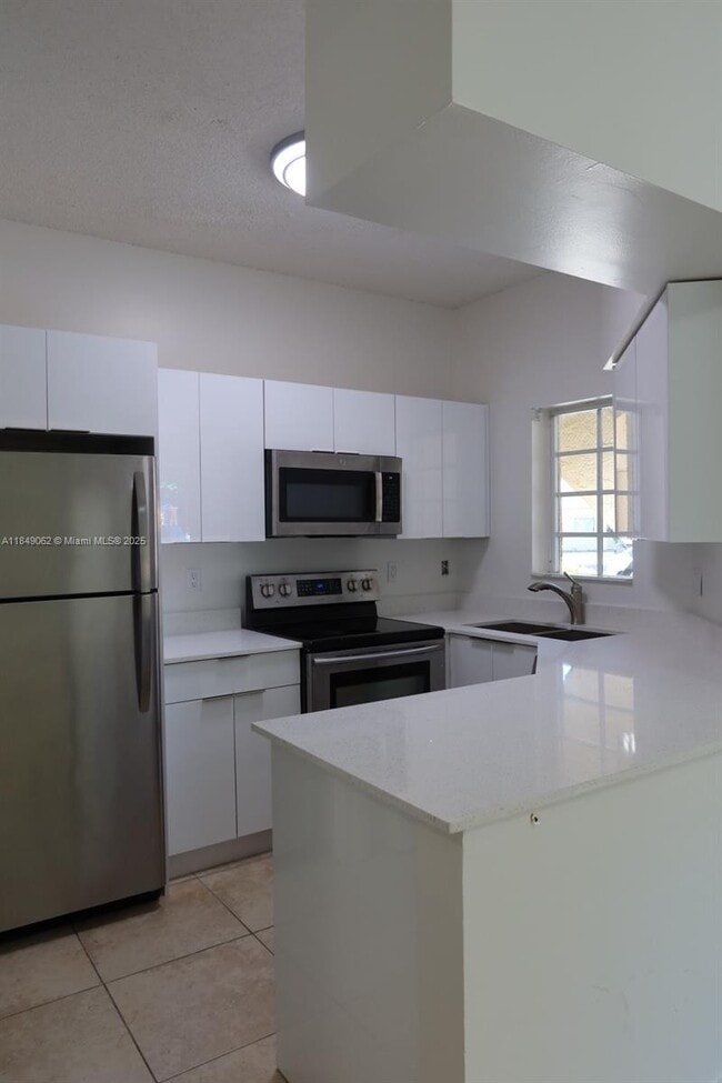 Building Photo - 18340 NW 68th Ave Unit A Rental
