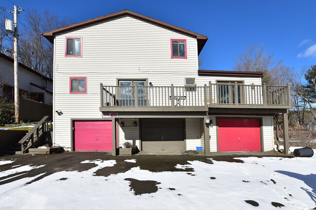 Front of house. Includes middle and right garages. - 3571 Smith Dr Apartments Unit 1