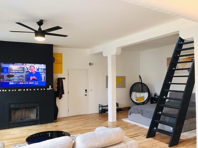 View into living room and open loft bedroom - 515 Noble N St Unidad 414 Rental