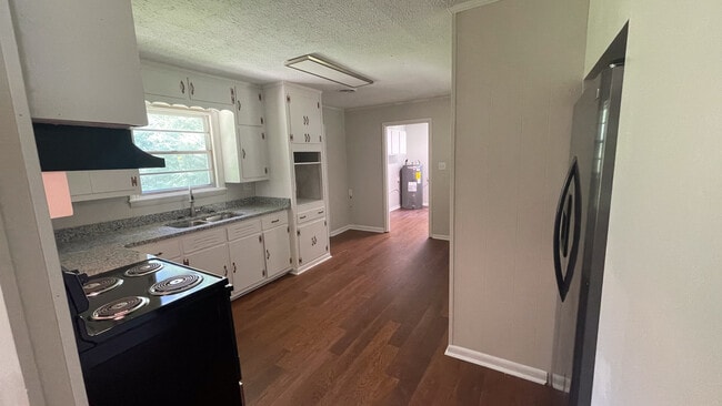 Newly Remodeled Kitchen with Stove and Fridge - 121 Drive 1417