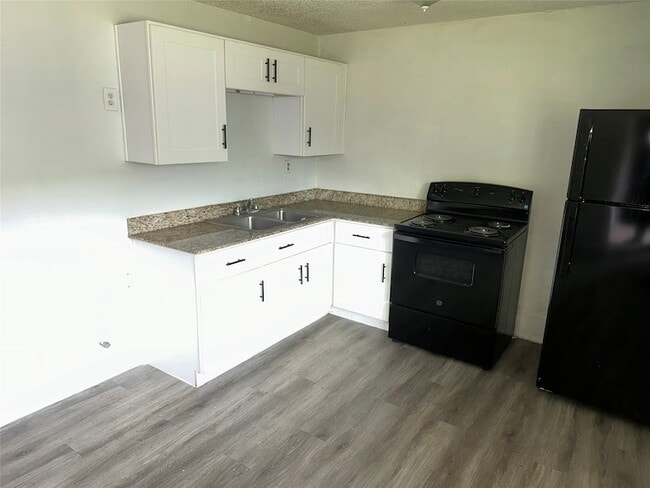 Building Photo - 5405 Suez St Unit 2
