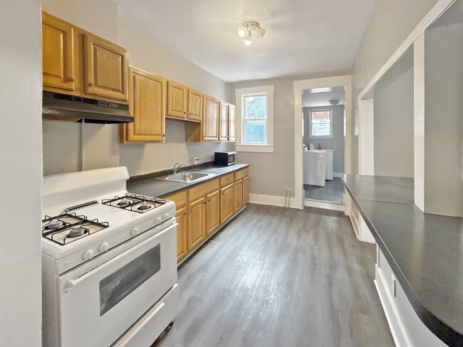 Photo - Modern Finishes, In-Unit Laundry & Bright Living Spaces